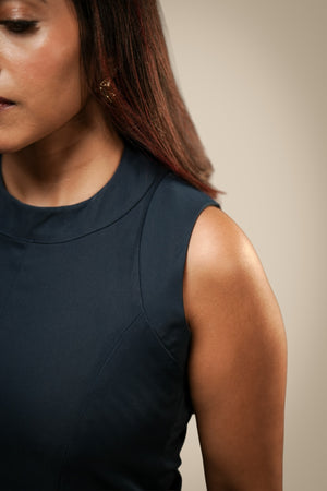 Structured teal sleeveless workwear dress, side view — Ikigara
